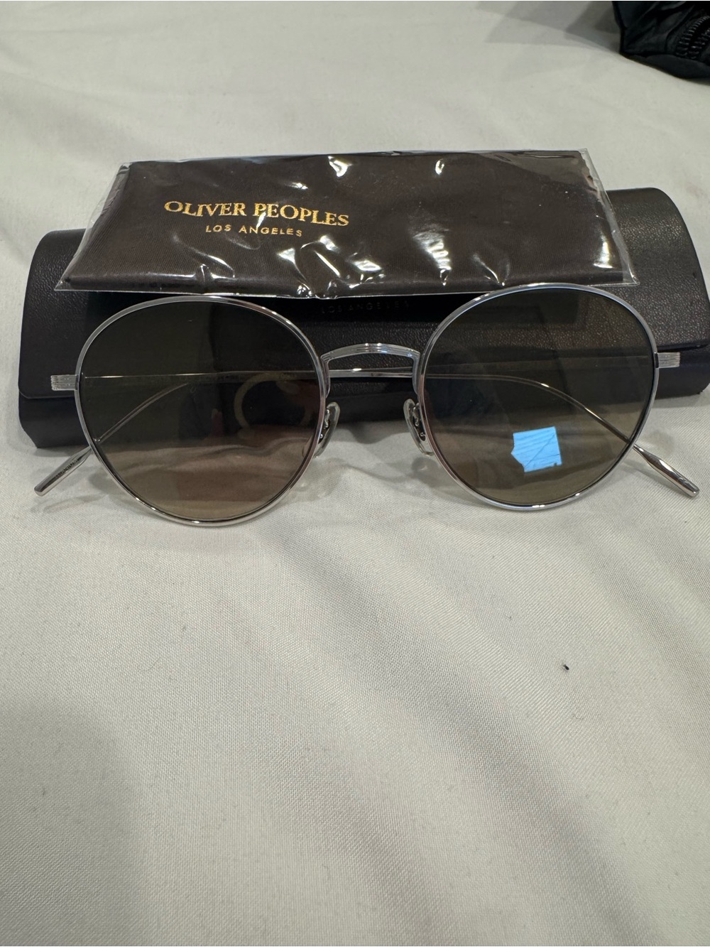 Oliver Peoples Silver Frame Sunglasses with Brown Lenses